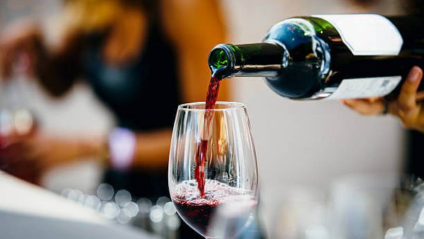 View Red Wine Being Poured Into Wine Glass